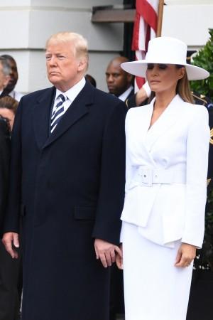 French President Emmanuel Macron (2nd L), US President Donald Trump (2nd R), First Lady Melania Trump (R) and Brigitte Macron participate in a state welcome at the White House in Washington, DC, on April 24, 2018. Donald Trump
