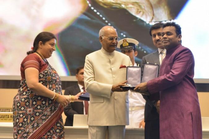 President Ram Nath Kovind presents the Rajat Kamal Award to music composer A.R. Rahman who won two honours -- music direction award for Tamil film 65th National Film Awards