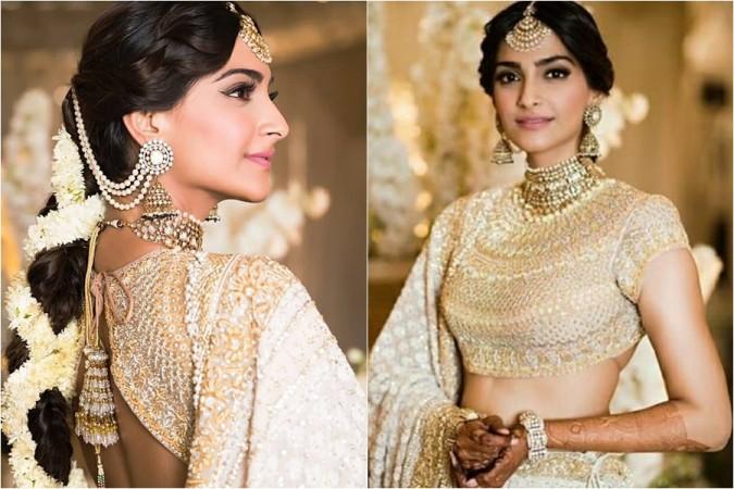 Sonam Kapoor looks resplendent in a Abu Jani-Sandeep Khosla Chikankari lehenga for her sangeet ceremony. Sonam Kapoor