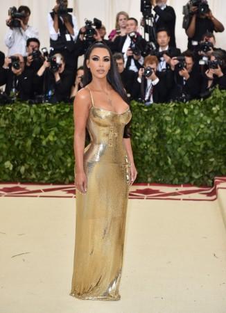 Kim Kardashian arrives for the 2018 Met Gala on May 7, 2018 at the Metropolitan Museum of Art in New York. - The Gala raises money for the Metropolitan Museum of Arts Costume Institute. The Gala's 2018 theme is Heavenly Bodies: Fashion and the Catholic Imagination Kim Kardashian