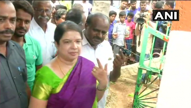 HD Kumaraswamy and wife Anitha after casting their votes HD Kumaraswamy and wife Anitha