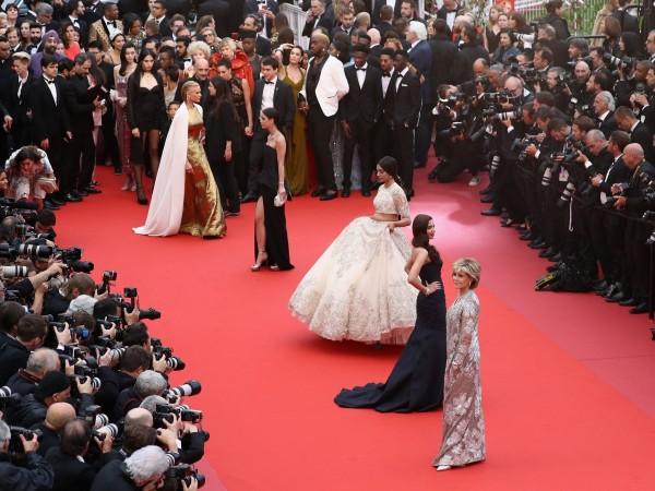 Sonam Kapoor and Mahira Khan pose as they arrive for the screening of the film 'BlacKkKlansman' at the 71st edition of the Cannes Film Festival in Cannes, southern France. Sonam Kapoor and Mahira Khan