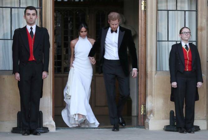 The newly married Duke and Duchess of Sussex, Meghan Markle and Prince Harry, leaving Windsor Castle after their wedding to attend an evening reception at Frogmore House, hosted by the Prince of Wales Windsor, Britain, May 19, 2018. Duke and Duchess of Sussex, Meghan Markle and Prince Harry