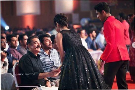 Kamal Haasan being greeted by Priya Prakash Varrier and Roshan. Mammootty is also seen in the picture. Kamal Haasan, Priya Prakash Varrier, Roshan and Mammootty