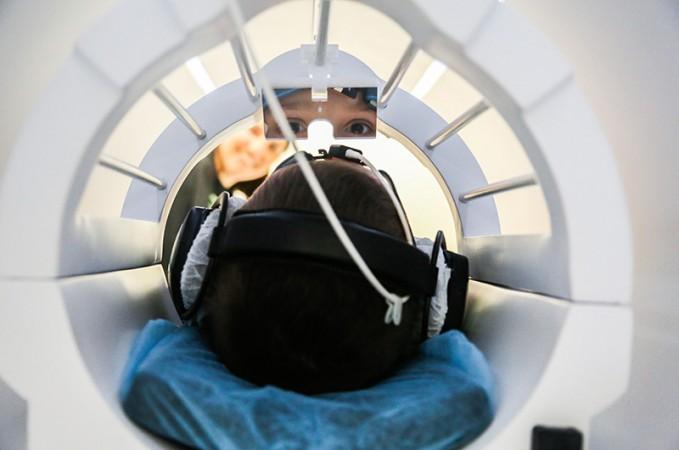 A person during fMRI scanning on their brain as a part of the study. (Florida International University) physics
