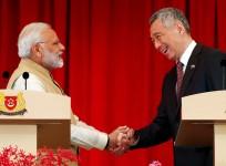 India's Prime Minister Narendra Modi shakes hands with Singapore's Prime Minister Lee Hsien Loong at the Istana in Singapore June 1, 2018. REUTERS/Edgar Su