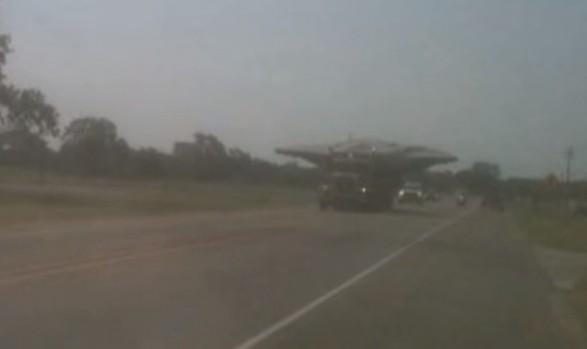 Flying saucer being transported on a truck (Youtube video grab) Flying saucer on truck