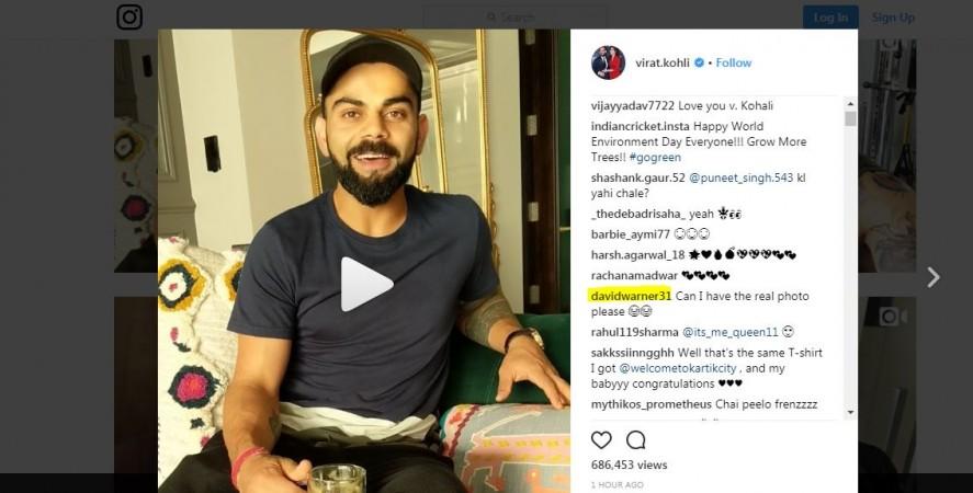 Screengrab of David Warner's comment on Virat Kohli's psot. David Warner comment