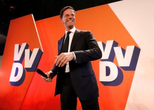Watch: Dutch PM Mark Rutte spills coffee in parliament, then mops it up