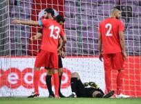 Mouez Tunisia's goalkeeper Mouez Hassen (C) lays down