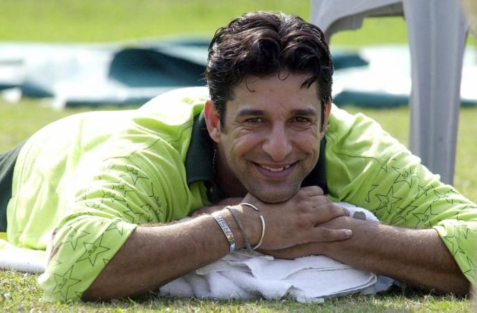 Pakistani pace sensation Wasim Akram smiles as he lays on the ground during their practice session at Bangabandhu National Stadium in Dhaka, 08 January 2002. Pakistani pace sensation Wasim Akram