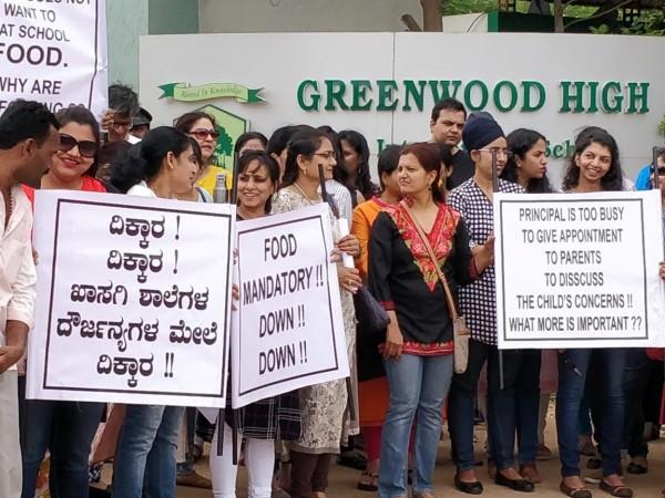 Parents protest outside the school against the feed hike and other new policies Parents protest outside the school