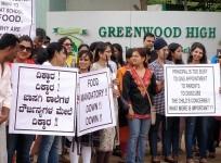 Parents protest outside the school