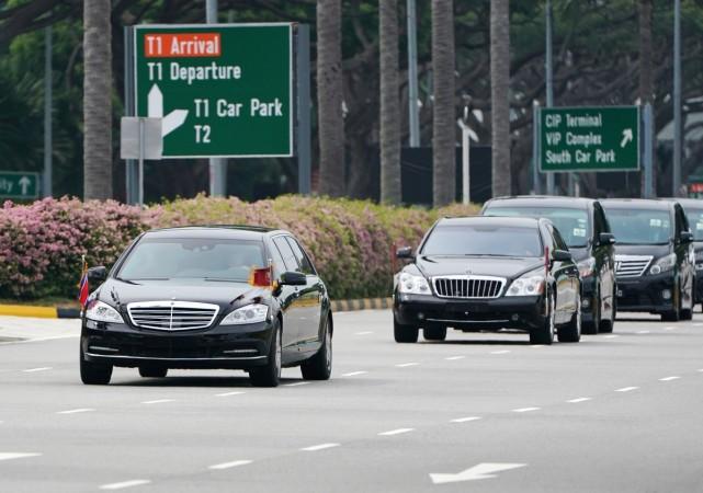 A vehicle believed to be carrying North Korea's leader Kim Jong Un travels past in Singapore. kim jong un car