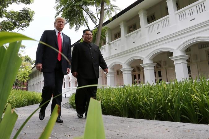 Donald Trump and North Korean leader Kim Jong Un walk after lunch Donald Trump Kim Jong Un