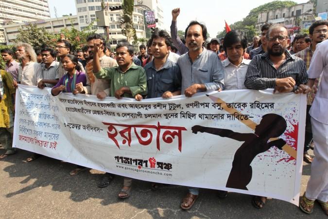 Protesters march in Dhaka on November 3, 2015 during a six-hour-long general strike. The strike was held in response to the recent murder of Faysal Arefin, a publisher of books by critics of religious militancy in Bangladesh bangladesh