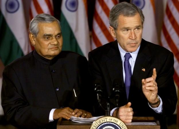 US President George W. Bush escorts Indian Prime Minister Atal Bihari Vajpayee to a press conference in the Grand Foyer of the White House, November 9, 2001 Atal Bihari Vajpayee