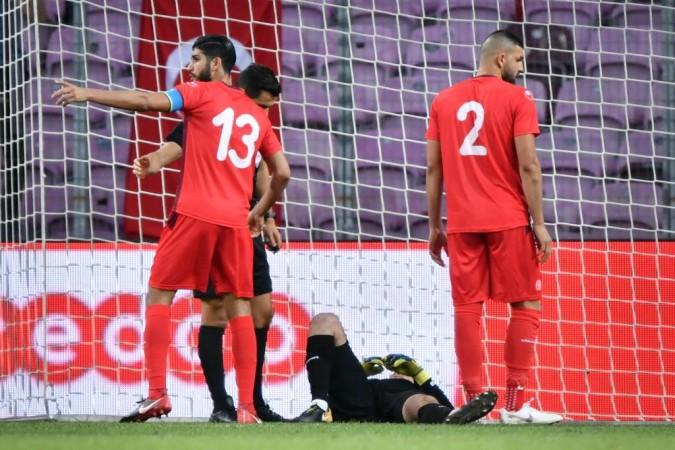 Tunisia goalkeeper Mouez Hassen fakes an injury to allow his teammates break their fast. Tunsia national football team