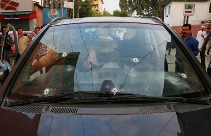 Bullet marks are seen on the car of Syed Shujaat Bukhari, the editor of Rising Kashmir daily newspaper, after unidentified gunmen attacked him outside his office in Srinagar, June 14, 2018. Shujaat Bukhari