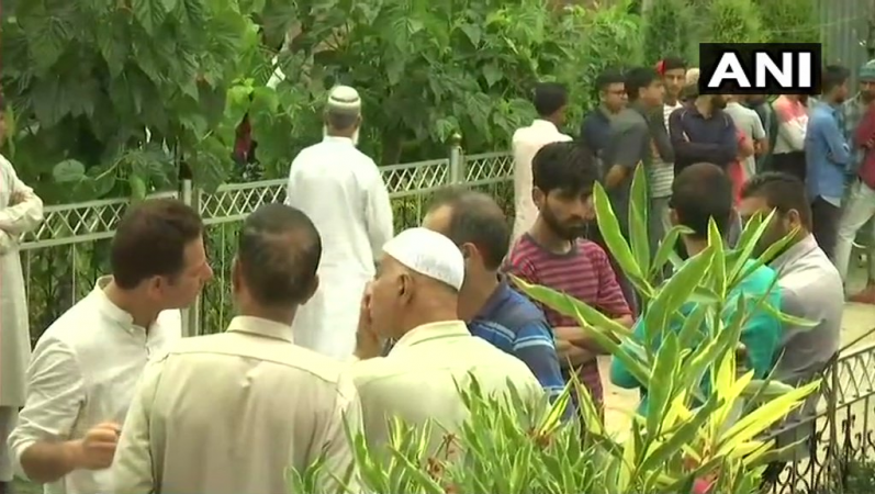 People arrive to pay their last respects to Shujaat Bukhari Shujaat Bukhari