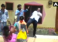 TRS member kicks woman