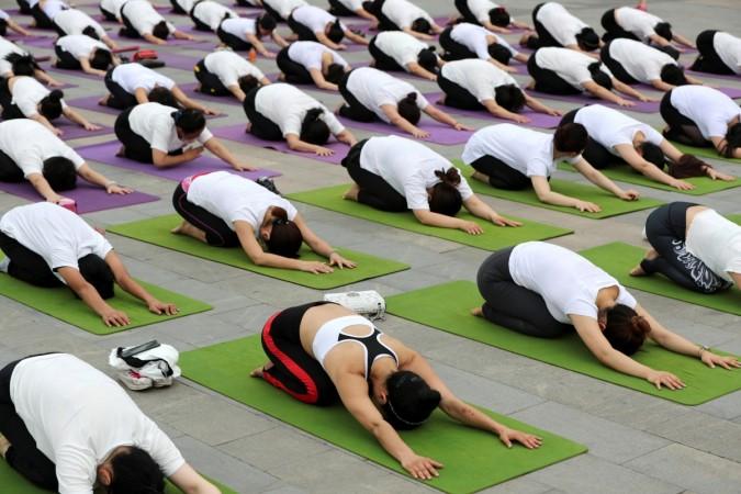 People practice yoga in Xiangyang, Hubei province, China. yoga