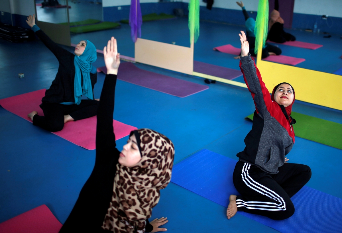 Palestinian women take part in a yoga session in Gaza City March 28, 2018. Yoga