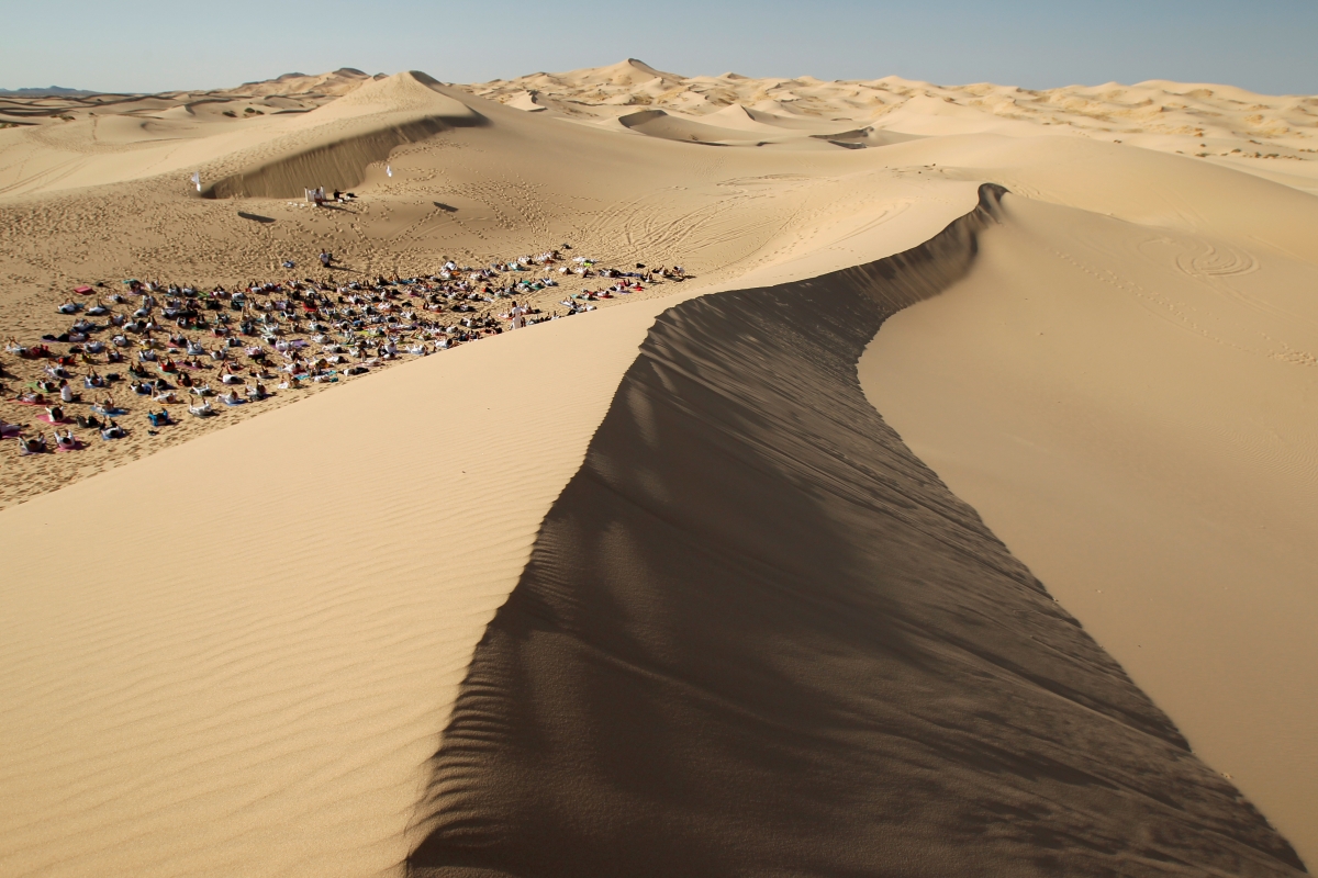 Yoga enthusiasts take part in a class at the Samalayuca dunes, on the outskirts of Ciudad Juarez, Mexico. yoga