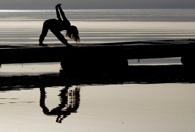 A girl practices vigorous activity on the banks of Lake Ohrid in Ohrid, Macedonia April 12, 2018 yoga