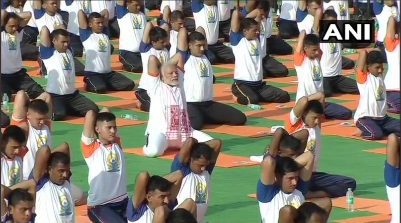 Modi performs yoga with volunteers at FRI Dehradun Modi performs yoga