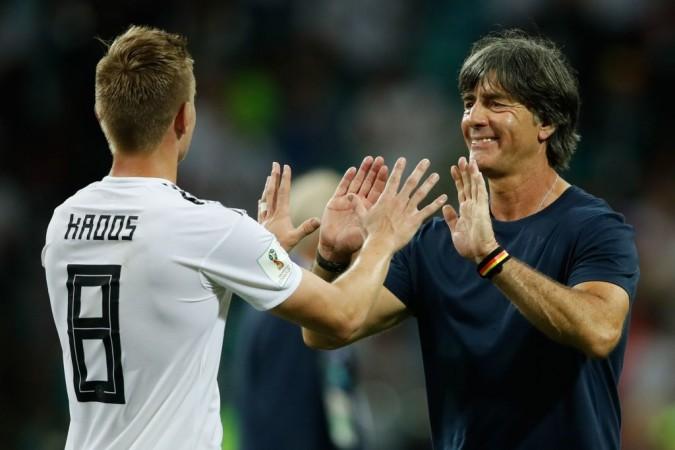 Toni Kroos celebrates with Joachim Low after the winning goal in Sochi. Toni Kroos and Joachim Low