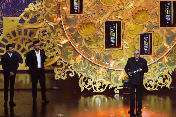 Bollywood film producer Boney Kapoor (R) receives the award in behalf of his late wife and actress Sridevi for her contribution to Indian cinema while Anil Kapoor (L) and Arjun Kapoor (2nd-L) looks on during the IIFA Awards IIFA Awards 2018