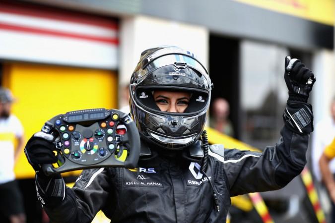 Aseel Al-Hamad of Saudi Arabia poses for a photo after driving the 2012 Renault F1 car Aseel Al-Hamad