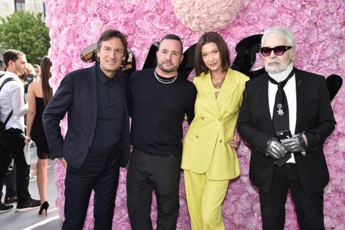 (L-R) Pietro Beccari, Kim Jones, Bella Hadid and Karl Lagerfeld attend the Dior Homme Menswear Spring/Summer 2019 show as part of Paris Fashion Week on June 23, 2018 in Paris, France. Bella Hadid