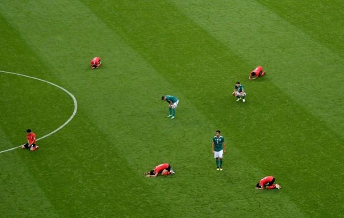 Agony and ecstasy: South Korea players are in disbelief after their win, while Germany are left stunned following their defeat Germany South Korea