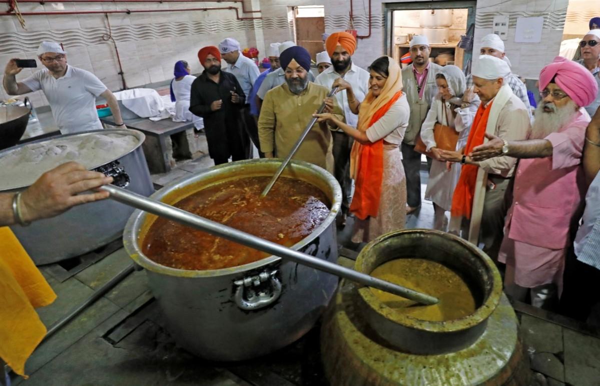 U.S. Ambassador to the United Nations Nikki Haley helps at a community kitchen inside a Gurudwara or a Sikh temple in the old quarters of Delhi, India June 28, 2018. Nikki haley
