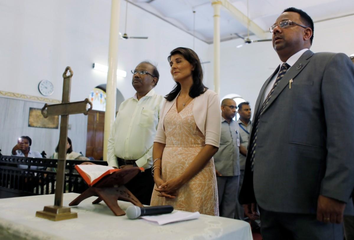 U.S. Ambassador to the United Nations Nikki Haley prays during her visit to a church in the old quarters of Delhi, India June 28, 2018. Nikki haley