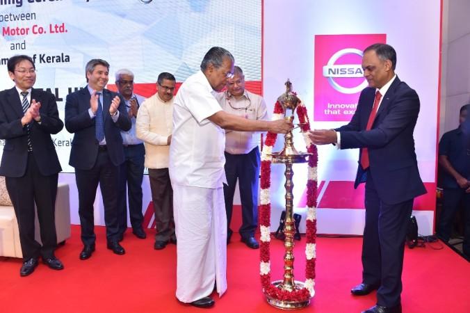 Pinarayi Vijayan, Chief Minister for Kerala and Tony Thomas, CIO, Nissan Motor Co. Ltd., lighting the ceremony at Thiruvananthapuram Nissan global digital hub, Kerala