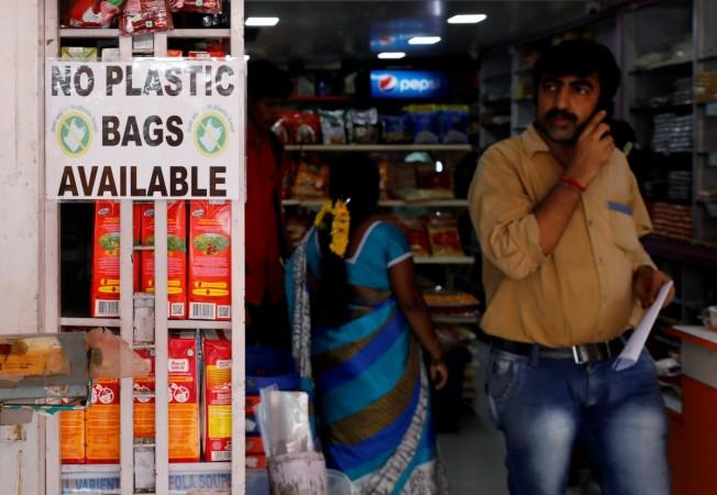A notice is pasted outside a shop stating the unavailability of plastic bags at a market in Mumbai, India, Maharashtra plastic ban