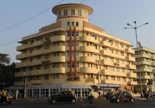 Vehicles passing by one of the Art Deco buildings on Marine Drive in Mumbai. The iconic structure was recognised as a World Heritage Site for its architecture on Saturday. Picture taken: November 8, 2017 Victorian And Art Deco Buildings