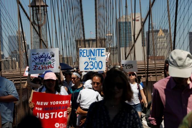 Demonstrators cross the Brooklyn Bridge during Anti-Trump protestors at Brooklyn Bridge in New York