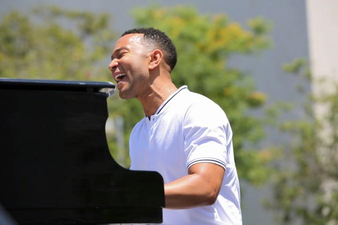 John Legend performs during a national day of action called John Legend performs 'Preach' at the anti-Trump protest in Los Angeles, California.