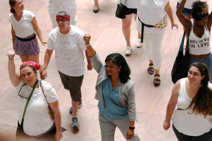 U.S. Representative Pramila Jayapal (D-WA) (C) walks to be arrested as she joined demonstrators calling for Pramila Jayapal at anti-Trump protest in Washington DC