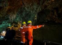 Soldiers and rescue workers work in Tham Luang cave complex