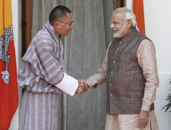 India's Prime Minister Narendra Modi (R) shakes hands with his Bhutanese counterpart Tshering Tobgay before the start of their bilateral meeting in New Delhi May 27, 2014 Narendra Modi and Tshering Tobgay