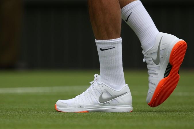Roger Federer was told not to wear orange-sole shoes at Wimbledon 2013. Roger Federer