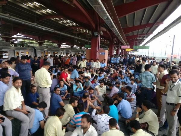Metro railway employees staging a sit-in demonstration at Yamuna Bank Metro station in New Delhi on June 29, 2018 Metro railway employees staging a sit-in demonstration