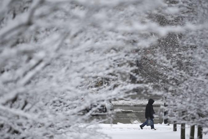 A man walks alone in the snow