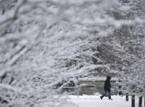 A man walks alone in the snow