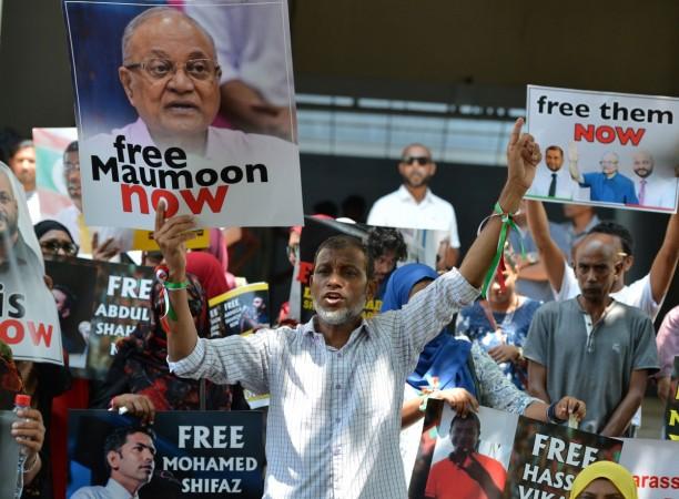 Supporters of former Maldivian president Mohamed Nasheed shout slogans during a protest against the current Maldives President Abdulla Yameen, demanding the release of opposition political prisoners in front of the Maldives embassy in Colombo protest against the current Maldives President Abdulla Yameen,